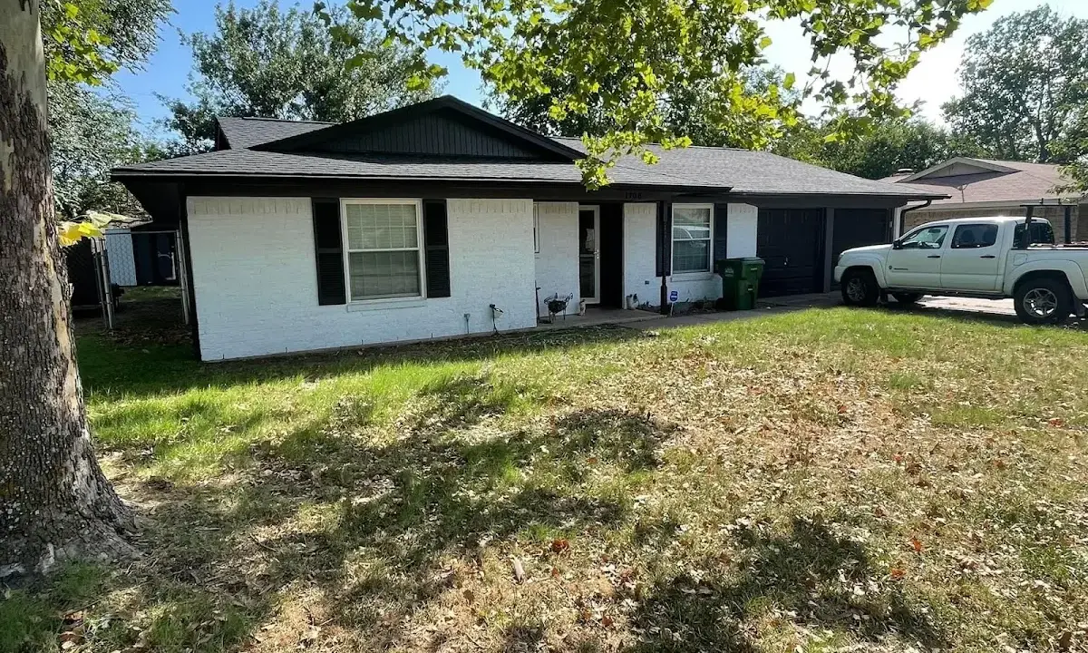 Professional roofing crew working on a residential roof in Lock Haven